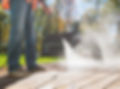 Man cleaning porch with high-pressure washer