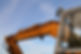 Close-up of an orange excavator arm