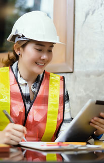Female engineer taking notes on iPad