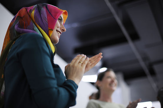 Woman and a Hijab clapping