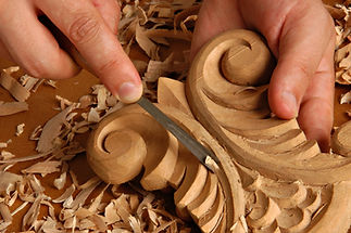 Close-up wood engraving showing intricate detail and decorative finishing expertise with precision