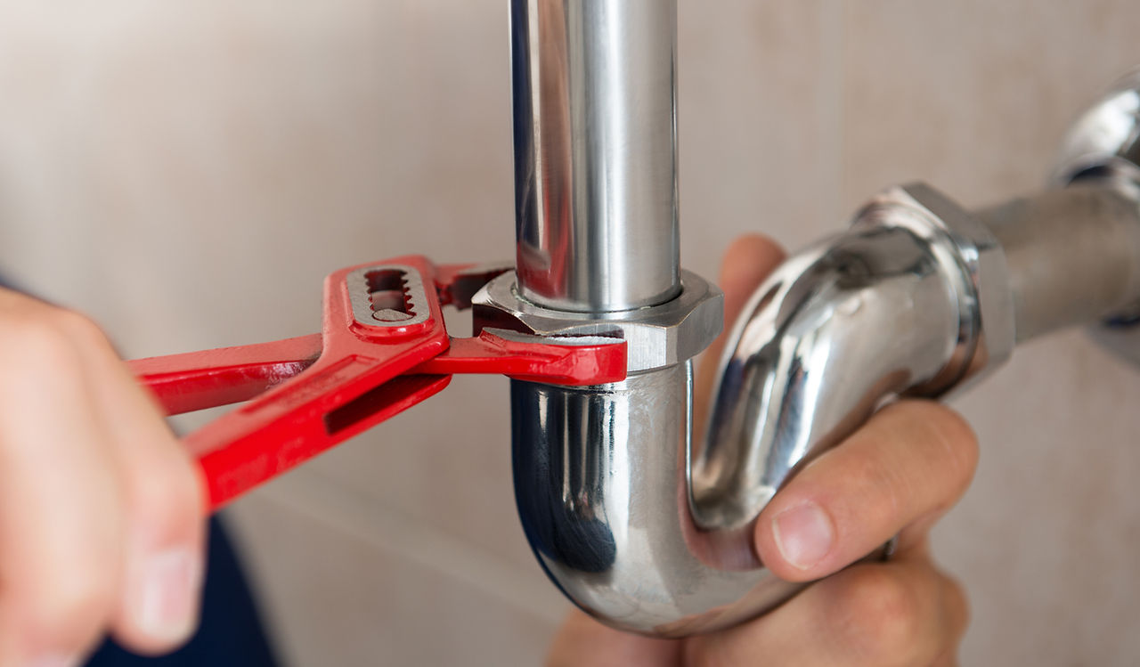 Plumber Fixing Pipes