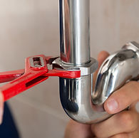 Plumber Fixing Pipes