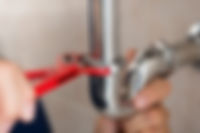 Plumber Fixing Pipes