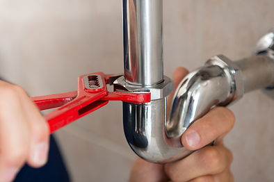 Plumber Fixing Pipes