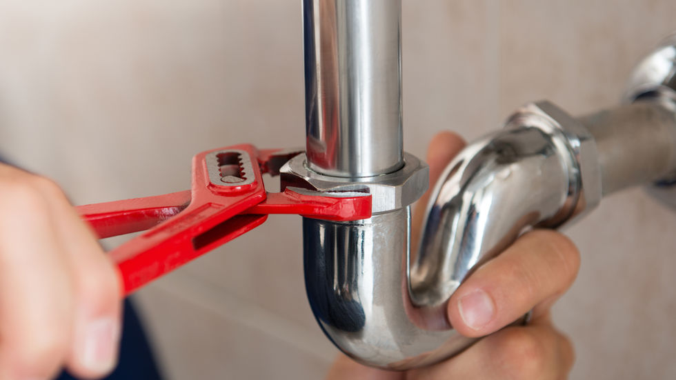 Plumber Fixing Pipes