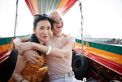 Two women travel agency owners excited about focusing on selling travel