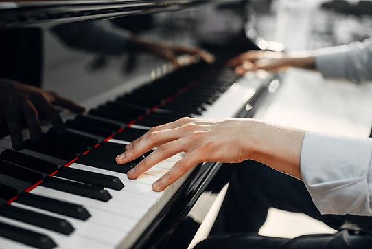 Fingers Playing Piano Keys
