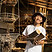 Happy Asian man holding logs