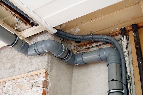 Low angle view of drain pipes