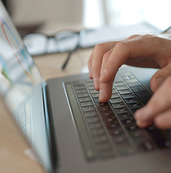 Businessman typing on laptop