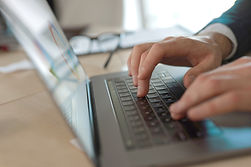 Businessman typing on laptop