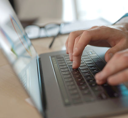 Businessman typing on laptop