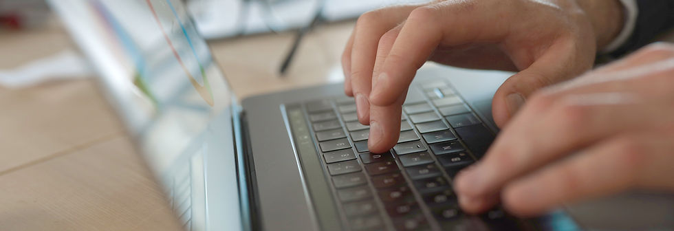 Businessman typing on laptop