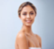 Smiling woman with light brown hair and subtle makeup 