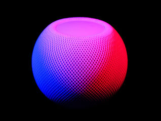 a modern round speaker with a pink/purple colour. to represent listening