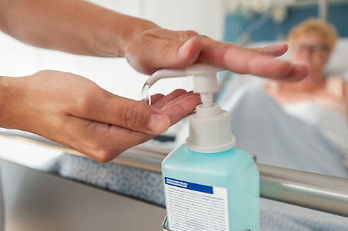 Close-up of hands using hand sanitizer