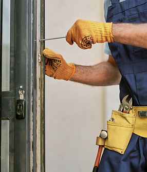 Repairman Fixing Door
