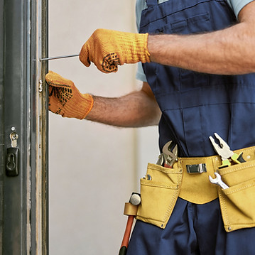 Repairman Fixing Door
