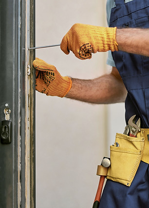Repairman Fixing Door