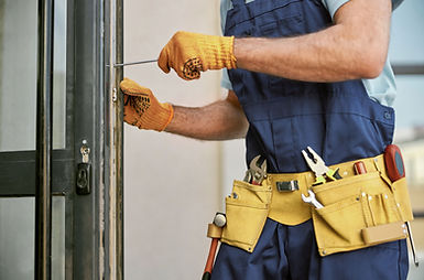 Repairman Fixing Door