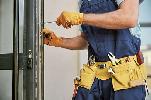Repairman Fixing Door