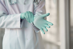 Doctor Wearing Surgical Gloves