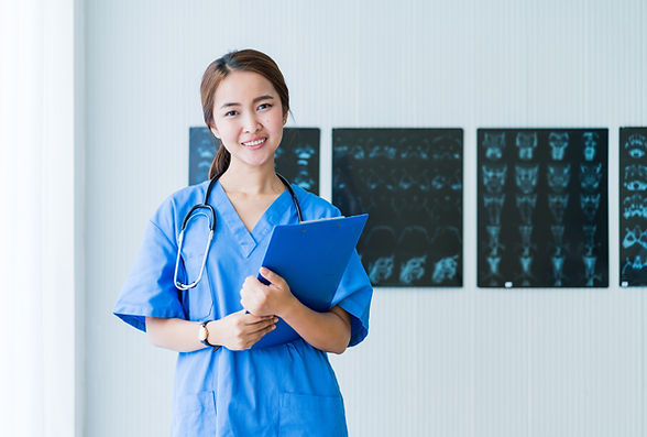Doctor In Blue Scrubs With Stethoscope