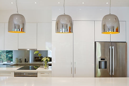 Contemporary pendant lights hanging over kitchen island bench