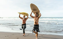 Two Surfers On Beach