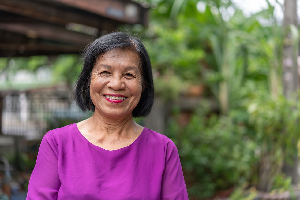 An old woman smiling happily