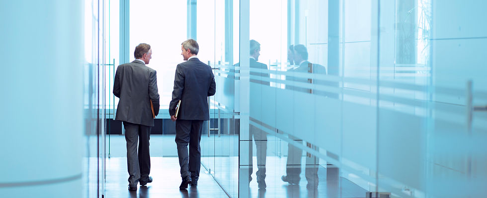 Businessmen in Corridor
