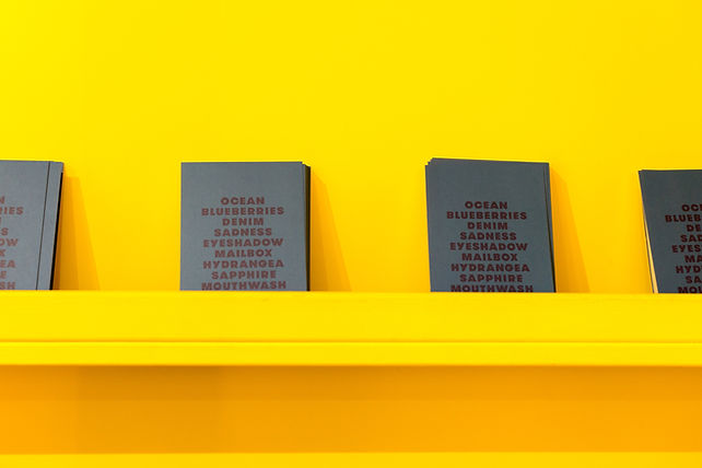 Books on a Yellow Wall