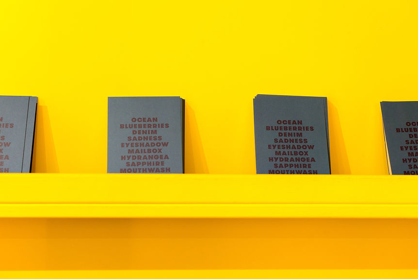 Books on a Yellow Wall