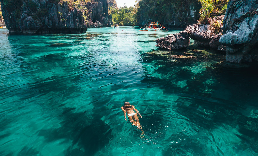 girl in beautiful swimming spot on island