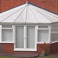 white brick conservatory at rear of house