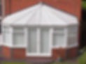 white brick and upvc conservatory at rear of house