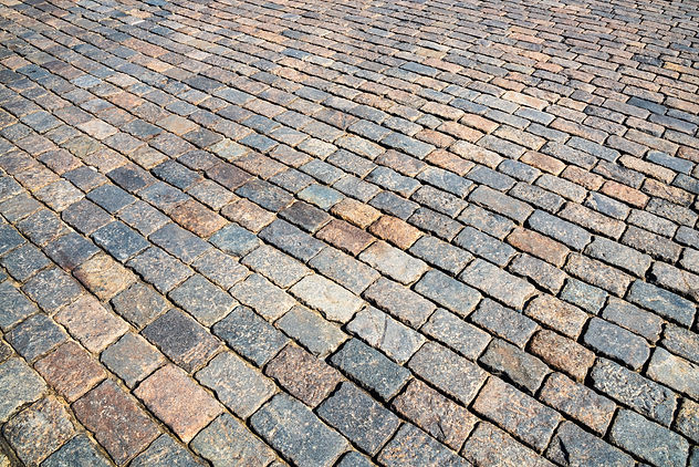 Close up of concrete block pattern of the pavement in urban street background