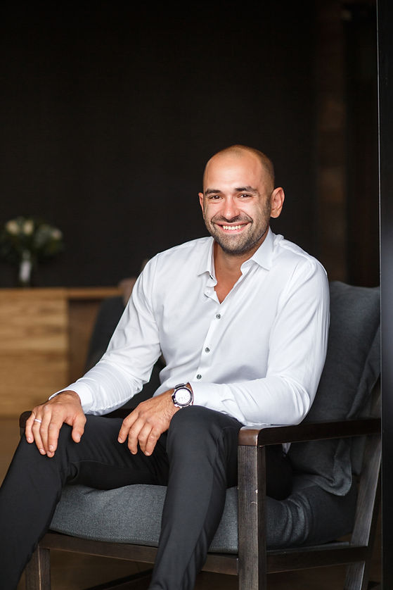 Smiling man sitting indoors