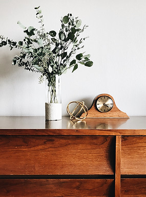 Wooden Table Clock with planter on a wooden console