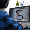 A picture of a young student during an online tutoring session.