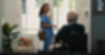 Nurse greeting elderly man