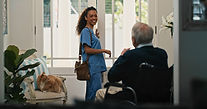 Nurse greeting elderly man