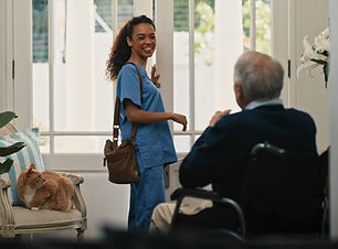 Nurse greeting elderly man