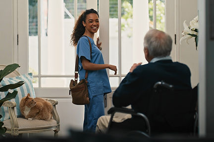 Nurse greeting elderly man