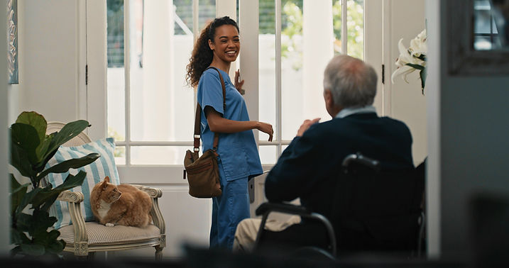 Nurse greeting elderly man