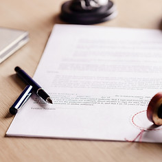 Notary pen resting on a signed testament