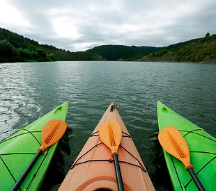 Three kayaks on water