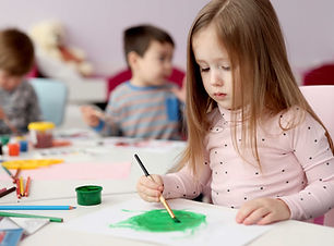 Girl Painting with Brush
