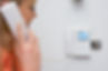 close-up of a woman using an intercom